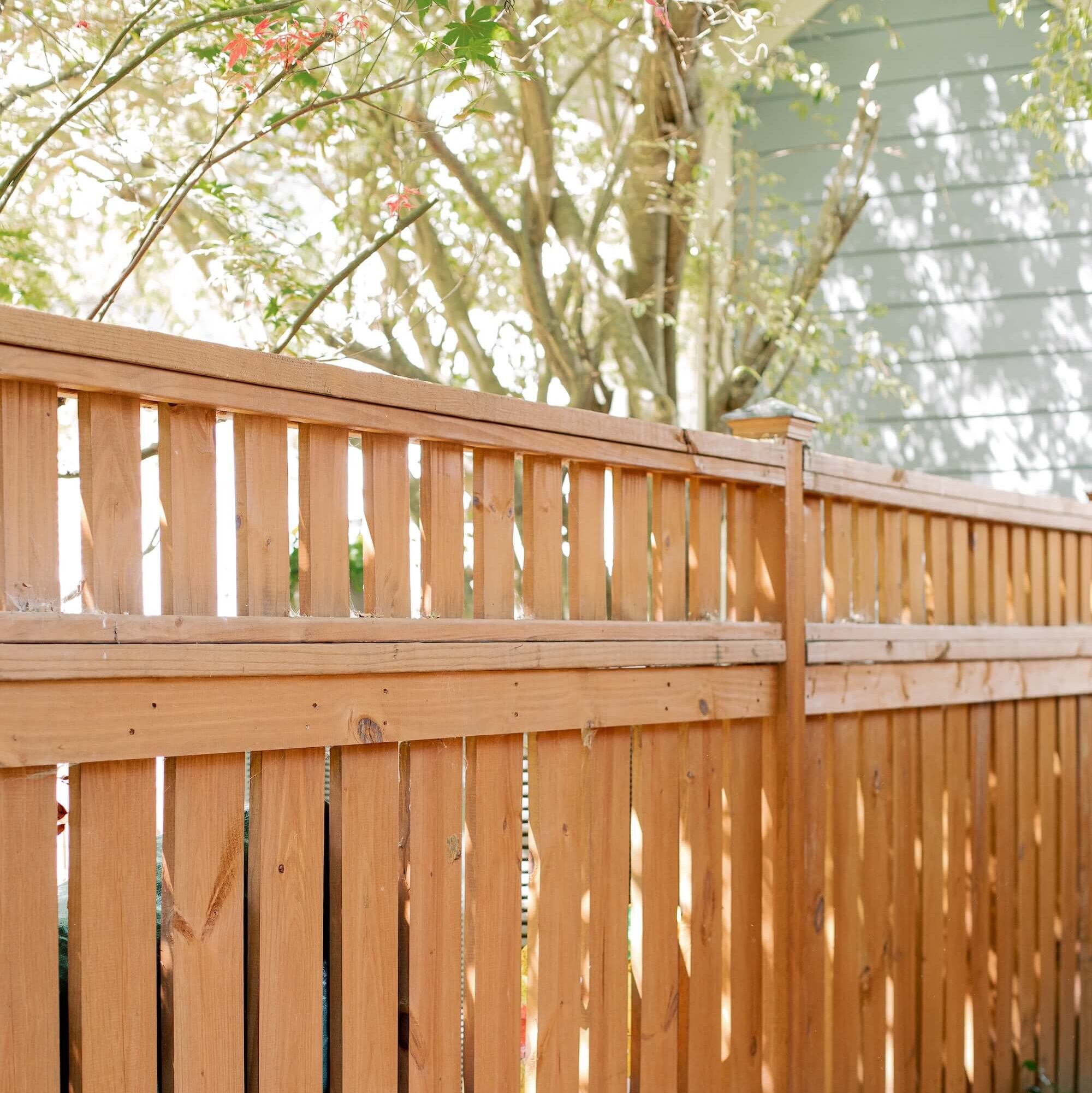 A newly built cap and trim wood fence that blends durability with a clean, polished look.